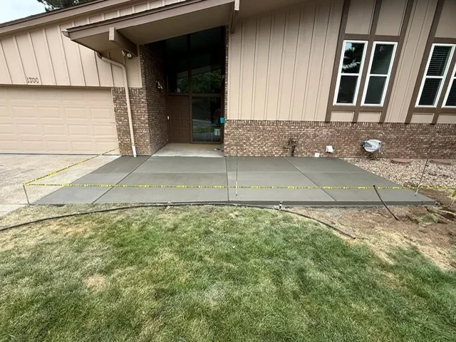 Newly poured concrete entryway and walkway at residential home in Englewood